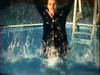 girl swims wearing skirt suit